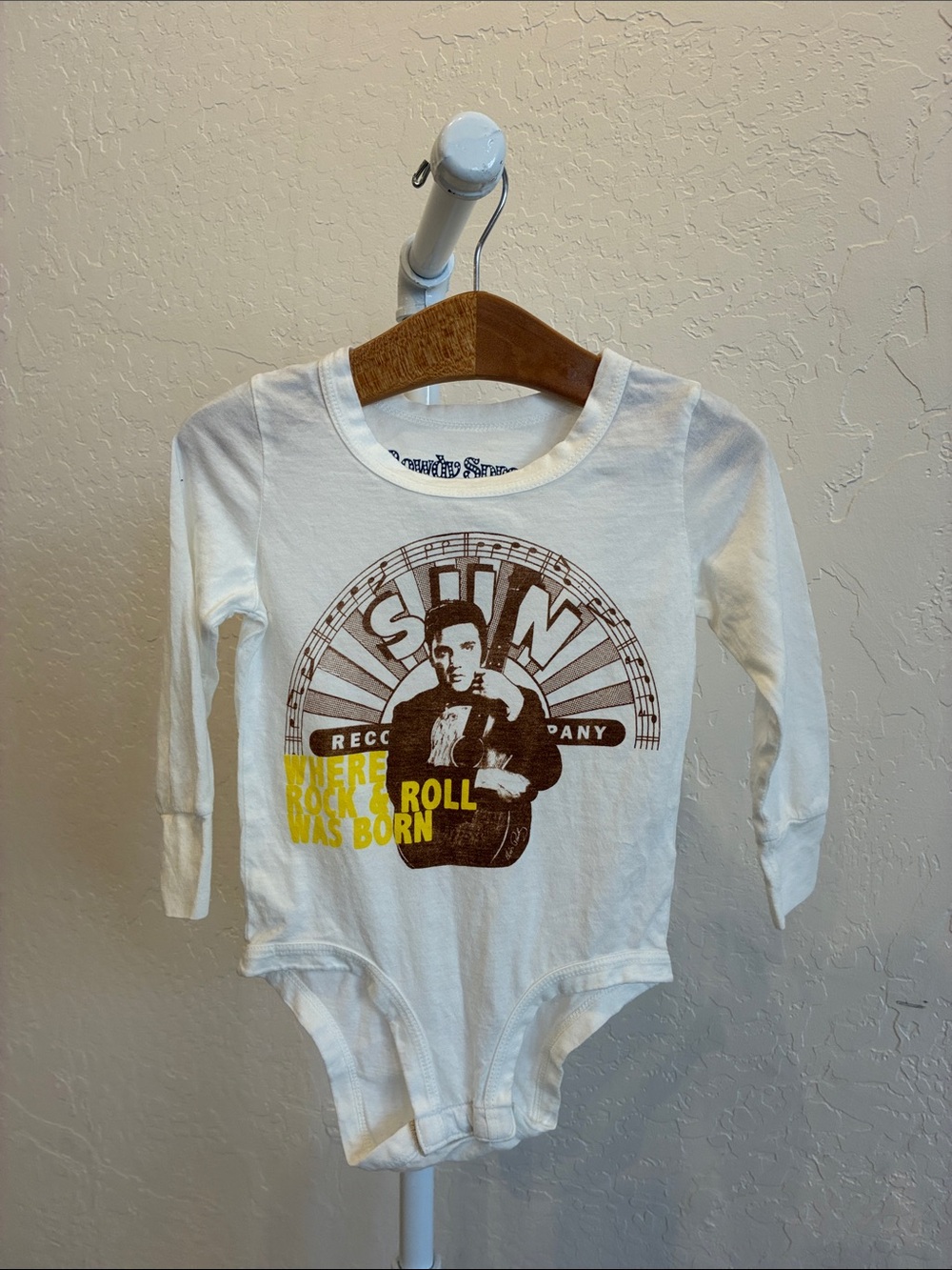 Rowdy Sprout White Baby Bodysuit with Brown Graphic and Yellow Text